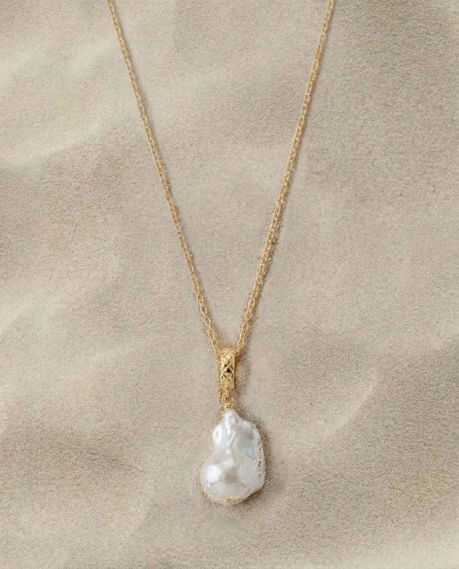 Gold clasp necklace with an irregular white pearl pendant