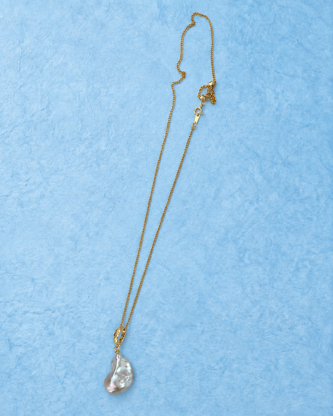 YEL-610 necklace on light blue background