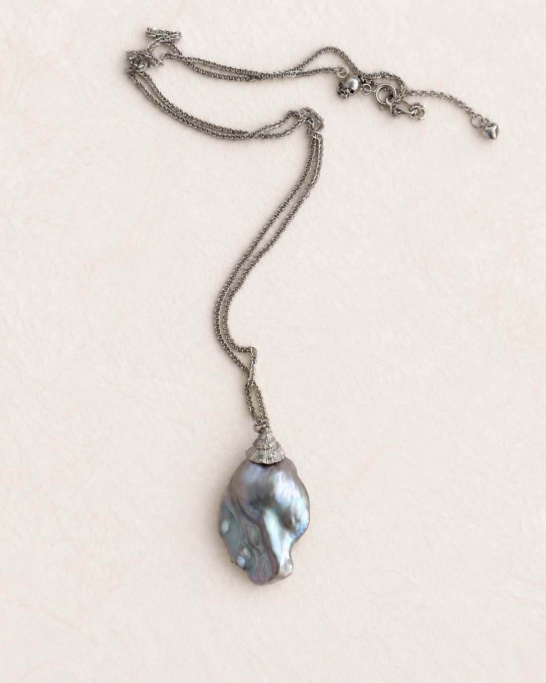 Tidescape Pendant Necklace on ivory background