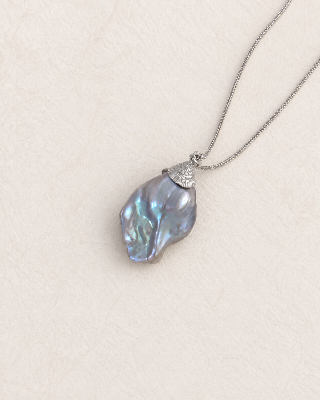 Tidescape Pendant Necklace on ivory background 2