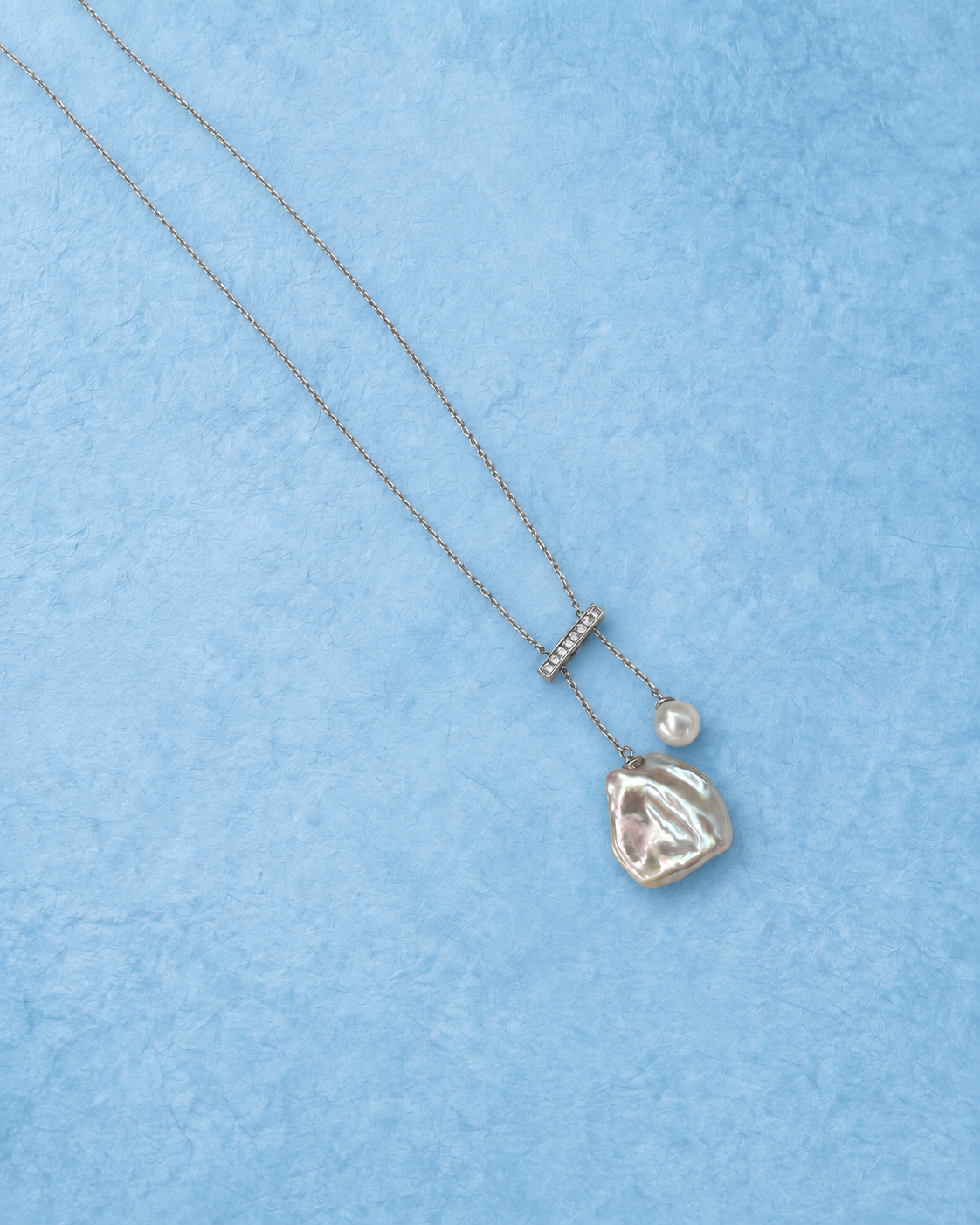YEL-723 necklace on light blue background