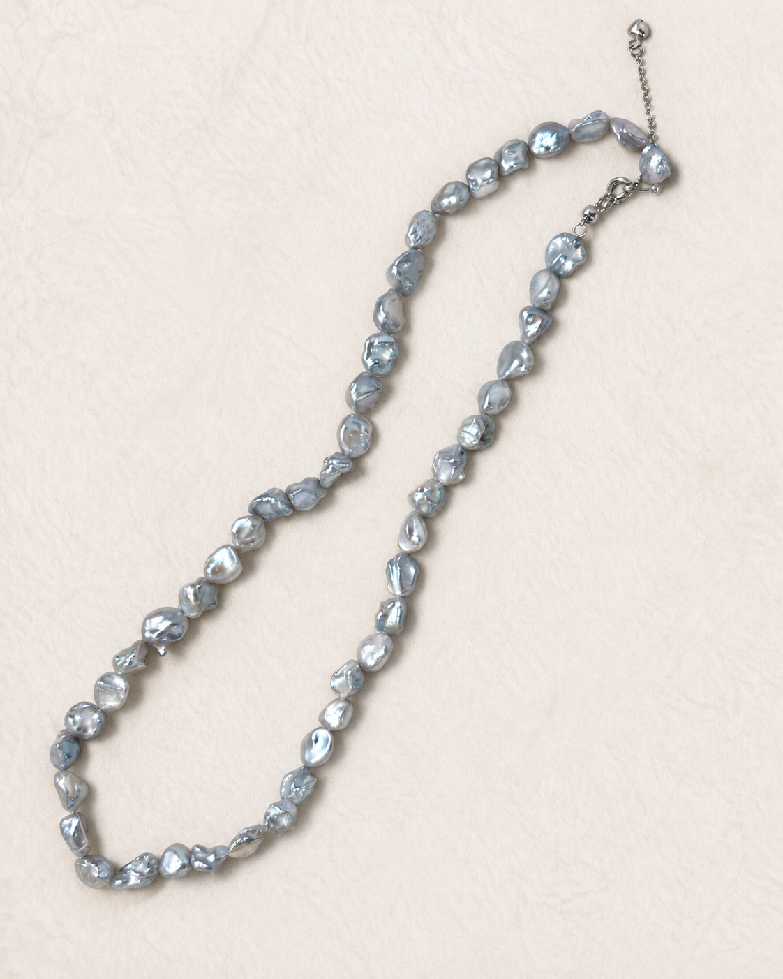 Blue Nacre Loop Necklace on ivory background, view 2
