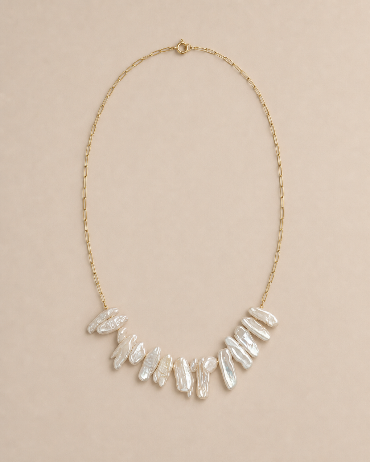 Crescent Biwa Pearl Necklace with irregular Biwa pearls on a warm greige background