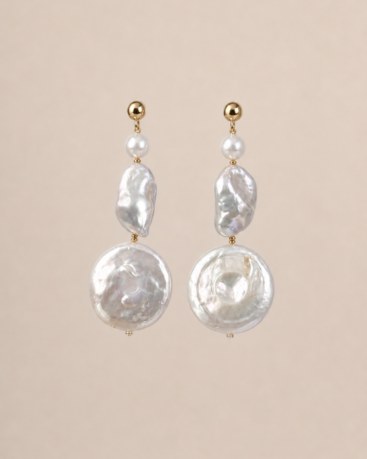 Luna Coin Pearl Drops on a warm neutral background