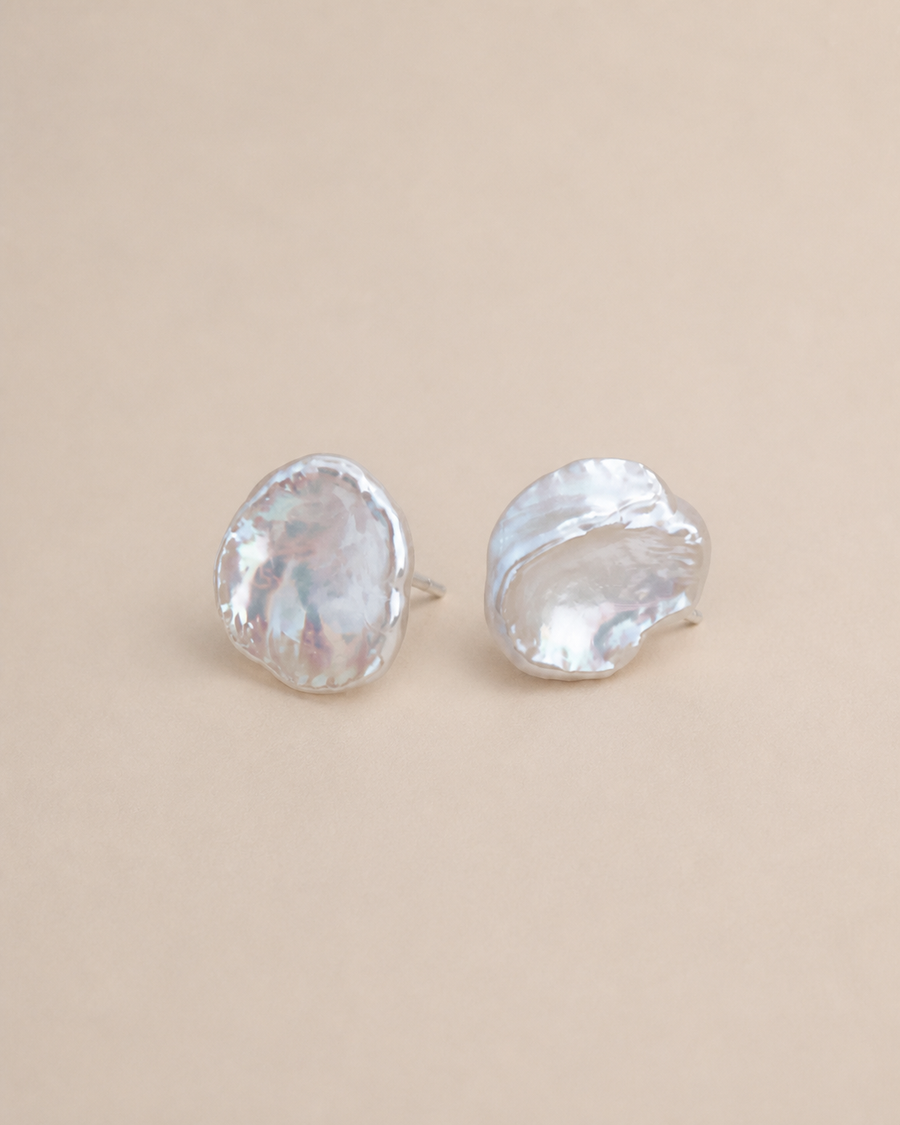 Petal Pearl Studs on a warm greige background