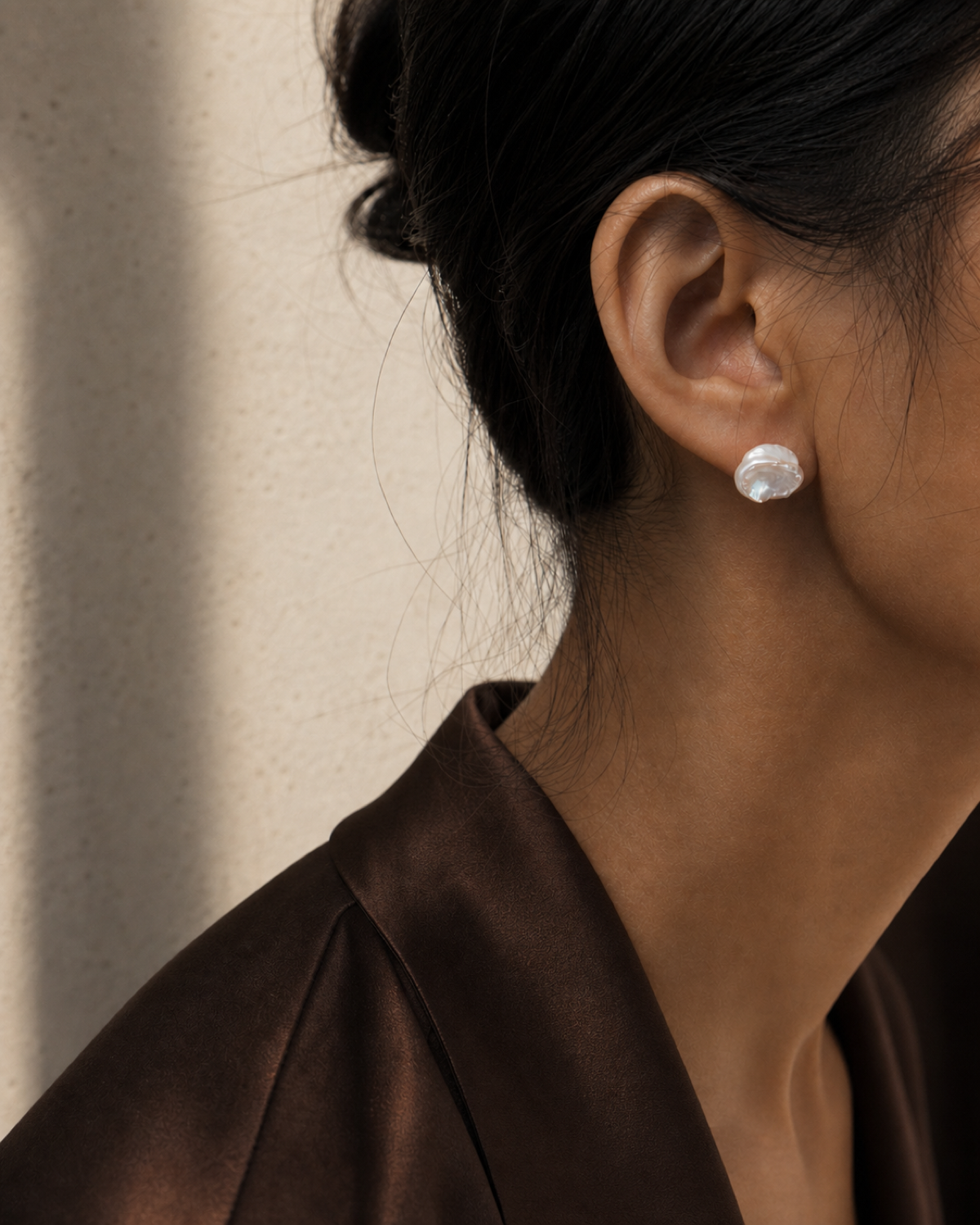 Petal Pearl Stud worn in a warm bronze and espresso editorial close-up