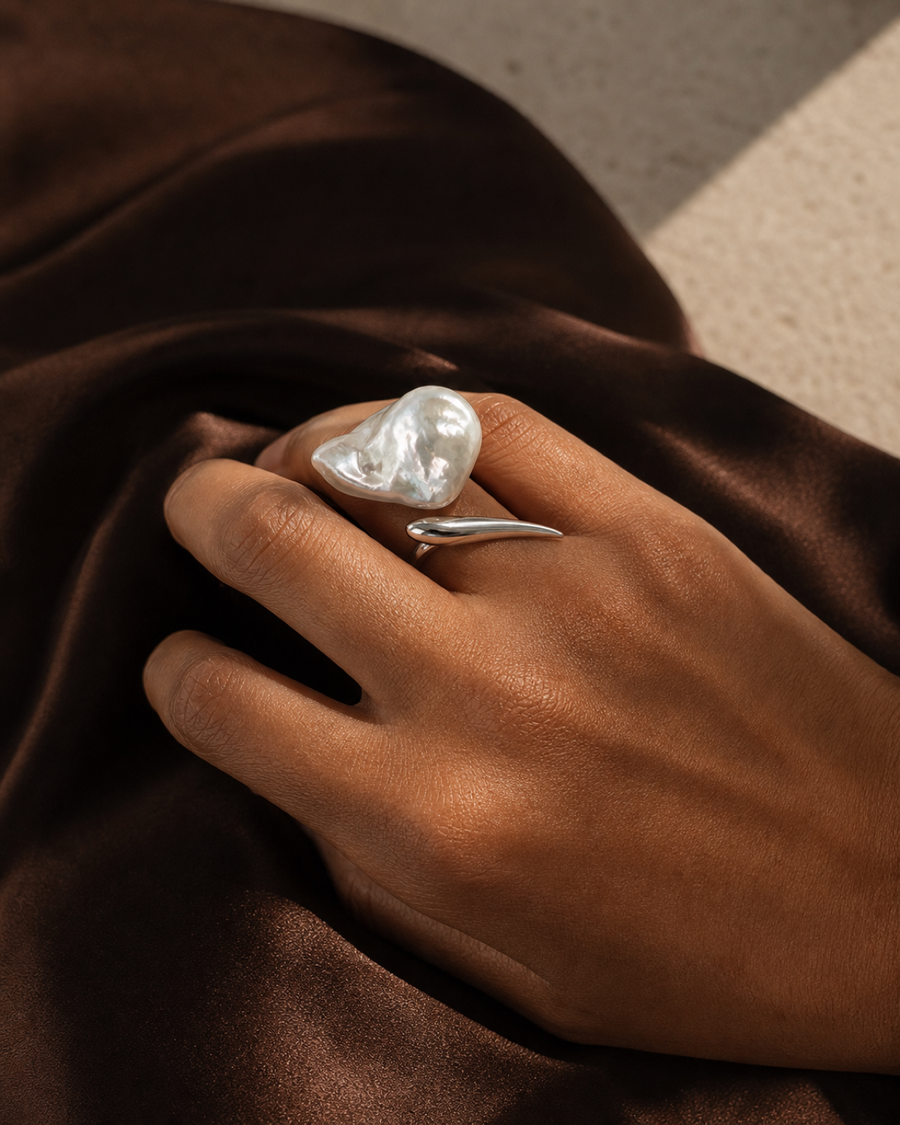 Veil Baroque Pearl Ring worn at its oversized real-world scale on one finger